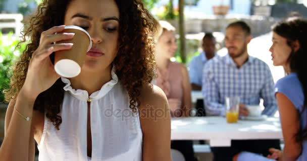 Woman having coffee at restaurant — Stock Video