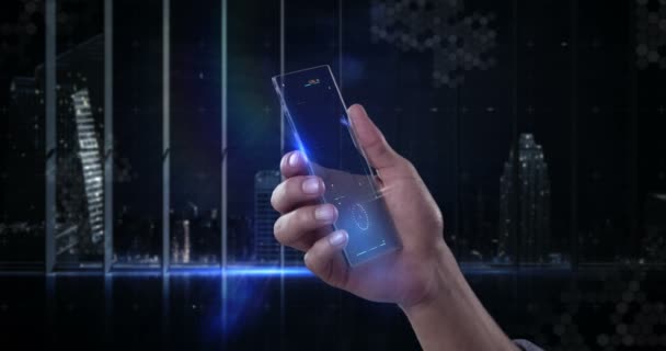 Mano che tiene il telefono cellulare futuristico sullo sfondo generato digitalmente — Video Stock