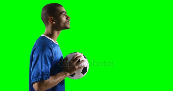 Profilo di football player holding football — Video Stock