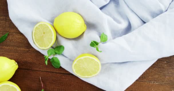 Lemon on wooden table — Stock Video