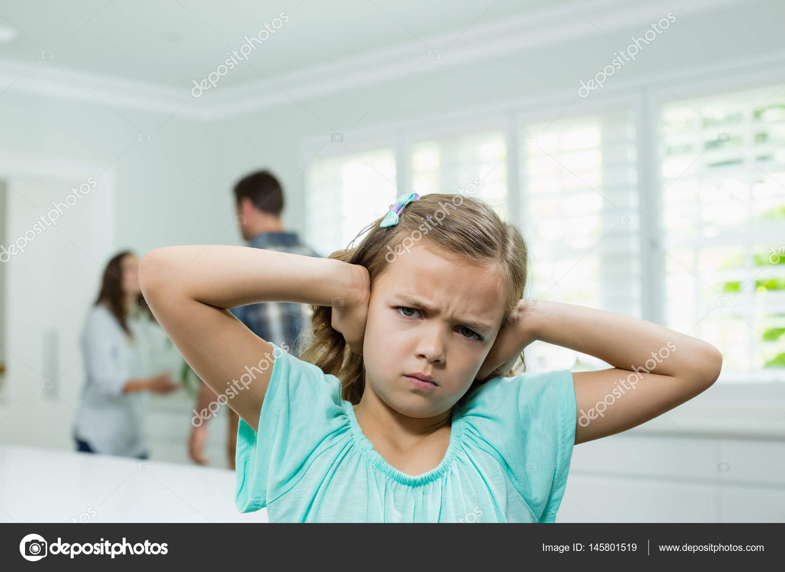 Girl covers ears with while parents arguing — Stock Photo © Wavebreakmedia 145801519