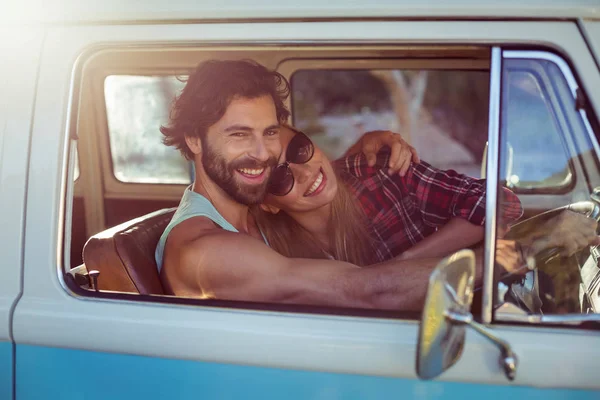 Couple sitting in a campervan — Stock Photo, Image