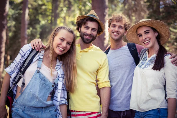 Group of friends standing together with arm around — Stock Photo, Image