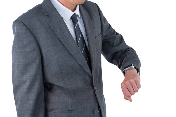 Mid section of businessman checking his smart watch — Stock Photo, Image