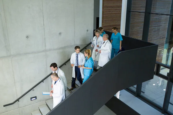 Group of doctors and surgeons interacting — Stock Photo, Image