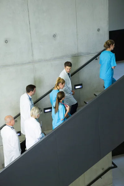 Doctors and surgeons interacting — Stock Photo, Image