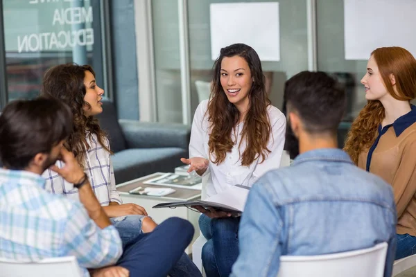 Male and female executives interacting with each other during meeting — Stock Photo, Image