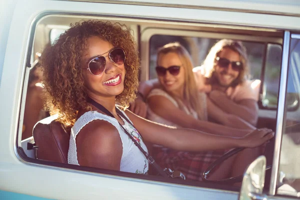 Happy woman driving a campervan — Stock Photo, Image