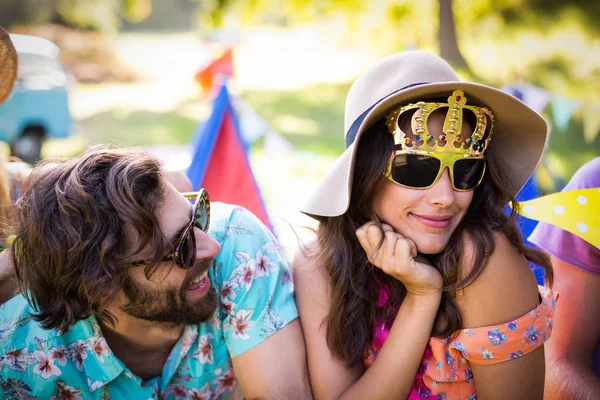 Friends interacting with each other in park — Stock Photo, Image