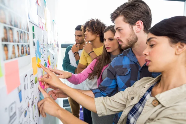 Graphic designers reading documents — Stock Photo, Image