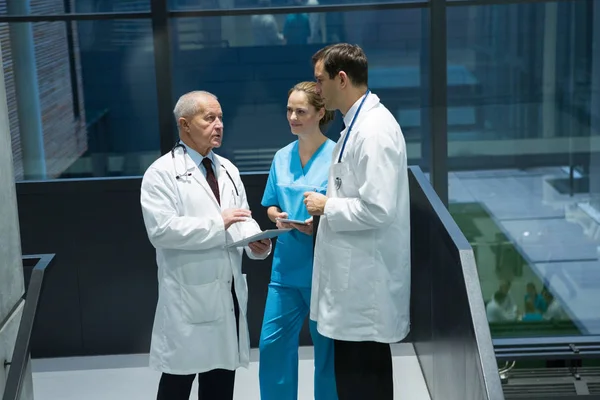 Doctors and surgeon interacting with each other — Stock Photo, Image