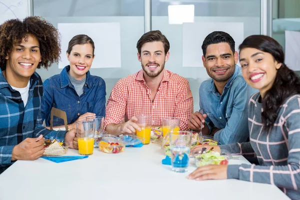 Portrait of smiling executives having breakfast — Stock Photo, Image