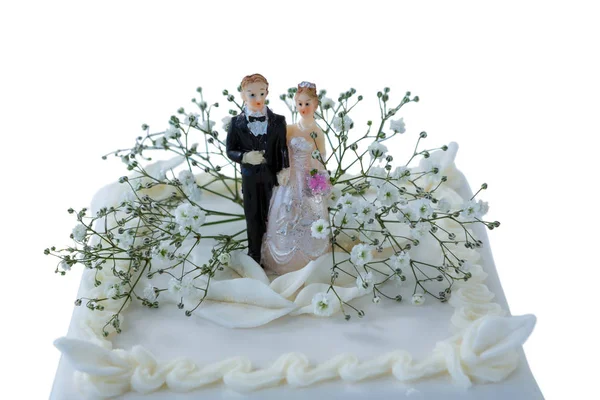 Wedding cake with couple figurines and flowers — Stock Photo, Image