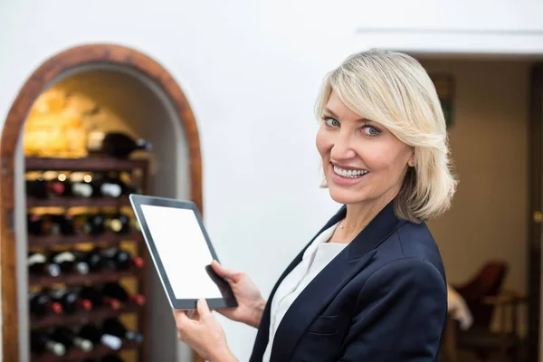 Businesswoman holding digital tablet in a restaurant Royalty Free Stock Images