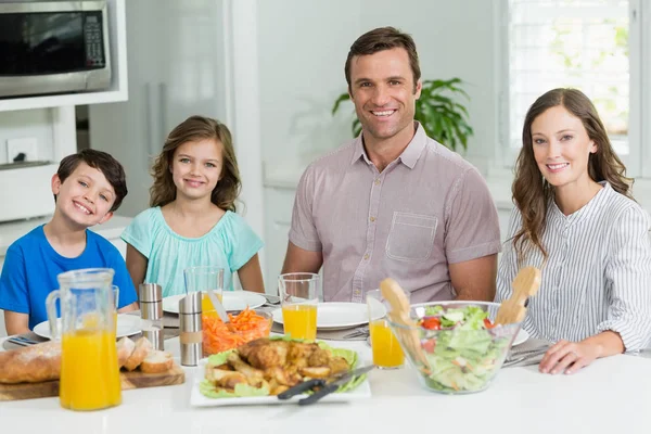 Smiling family having lunch together — Stock Photo, Image