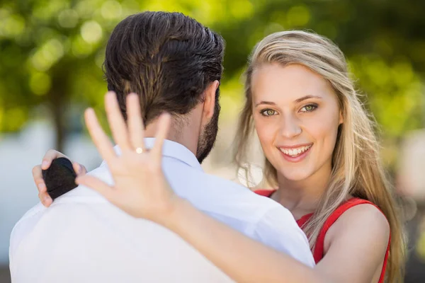 Beautiful woman looking at her ring — Stock Photo, Image