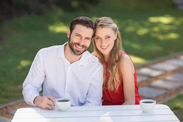 Portrait of happy couple having coffee — Stock Photo, Image