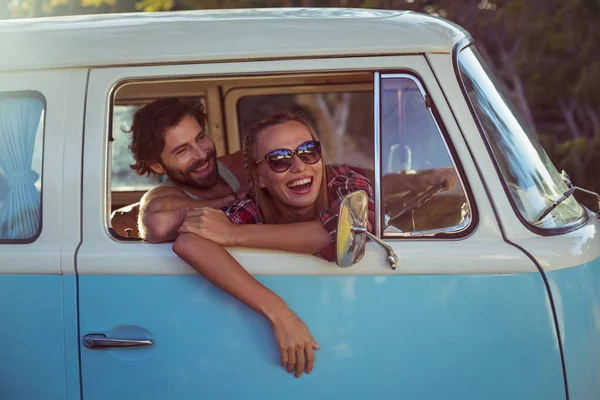 Couple sitting in a campervan — Stock Photo, Image