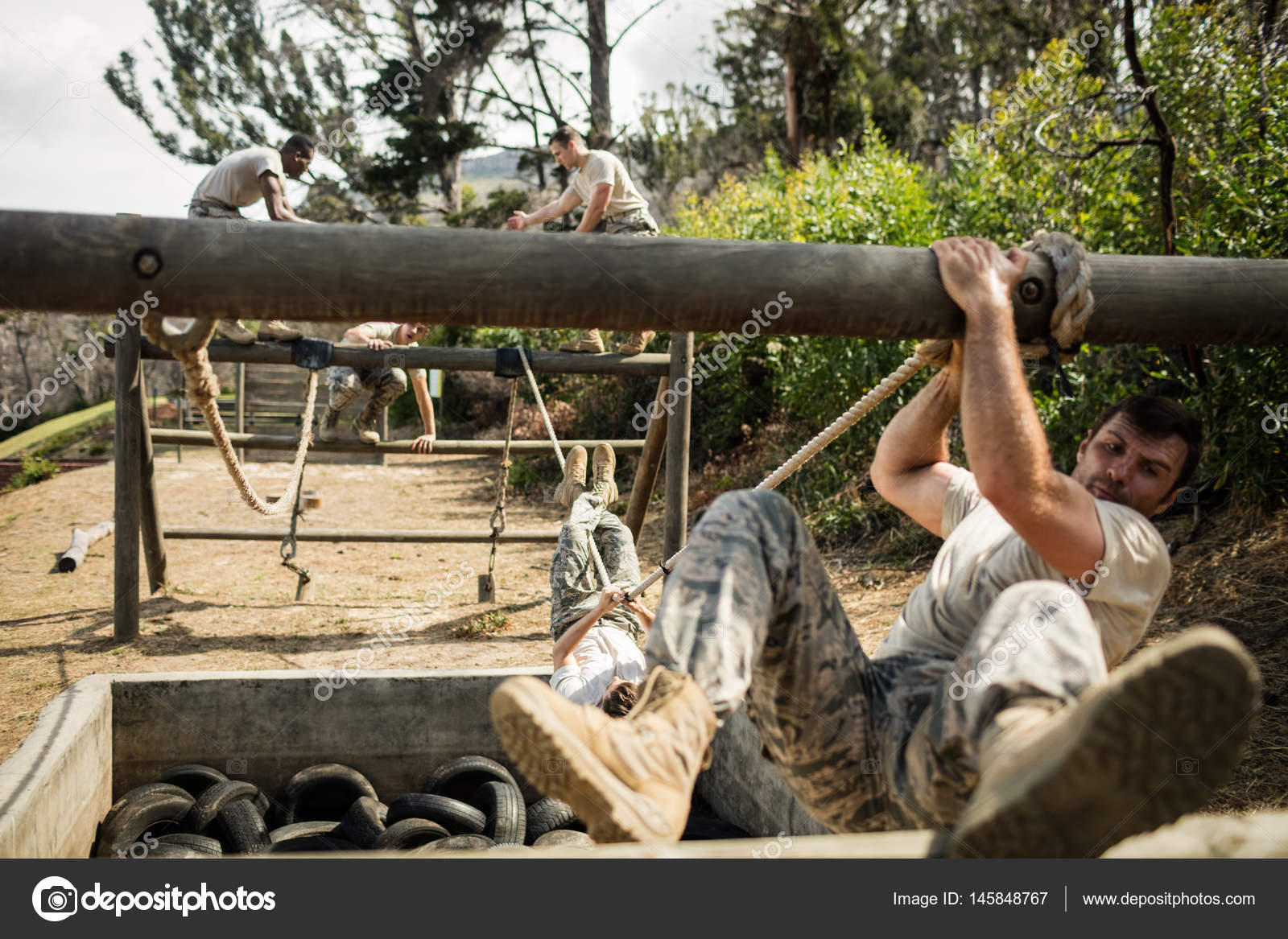 Young military soldiers practicing rope climbing during obstacle course  Stock Photo by ©Wavebreakmedia 145848767, military rope climb