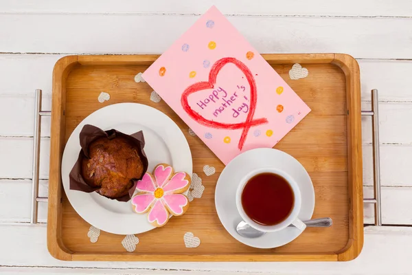 Happy mothers day greeting card with tea and snacks — Stock Photo, Image