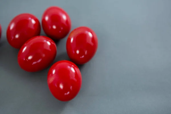 Red Easter eggs on grey background — Stock Photo, Image