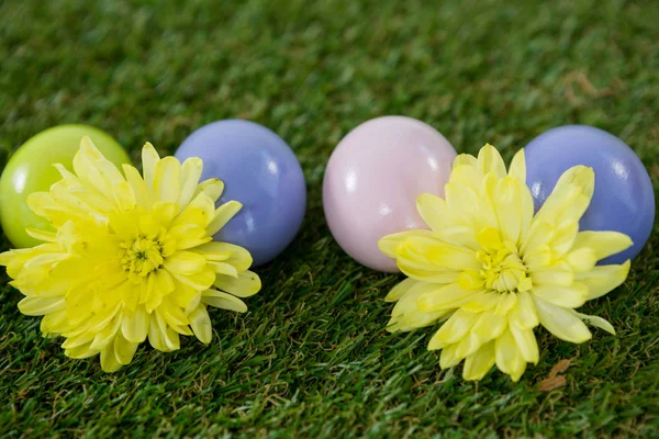 Multicolored Easter egg on grass — Stock Photo, Image