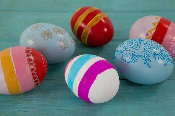 Various Easter eggs on wooden surface — Stock Photo, Image