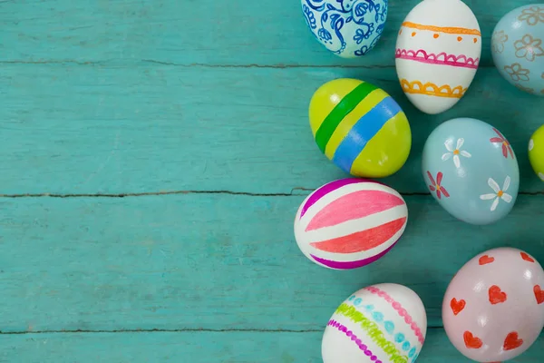 Painted Easter eggs on wooden plank — Stock Photo, Image