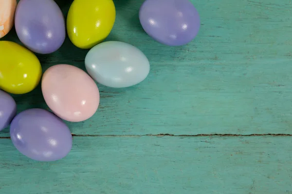 Various Easter eggs on wooden surface — Stock Photo, Image