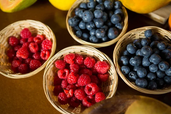Raspberry and blueberry on the counter — Stock Photo, Image