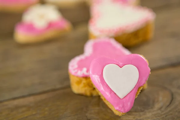 Heart shape cookies on wooden plank — Stock Photo, Image