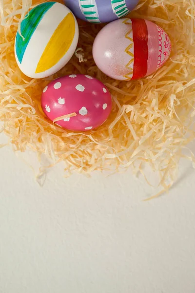 Painted easter eggs in nest — Stock Photo, Image