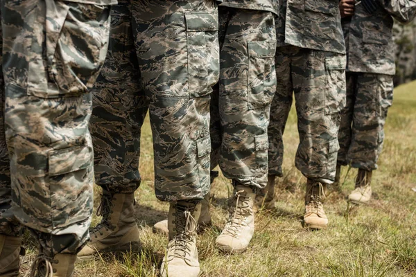 Low-section of military soldiers standing in line — Stock Photo, Image