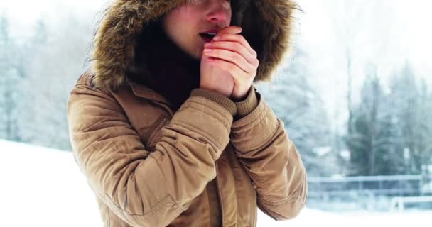 Woman in fur jacket warming her hands — Stock Video