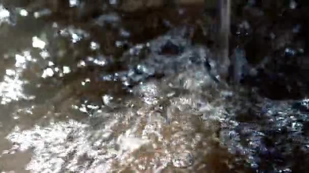 Water flowing from tap into pool — Stock Video