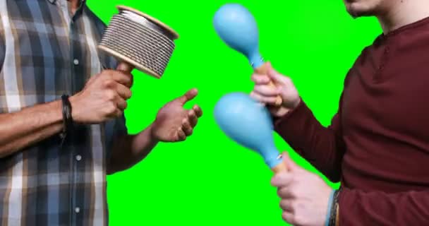 Mid section of male musicians playing cabasa and maraca — Stock Video