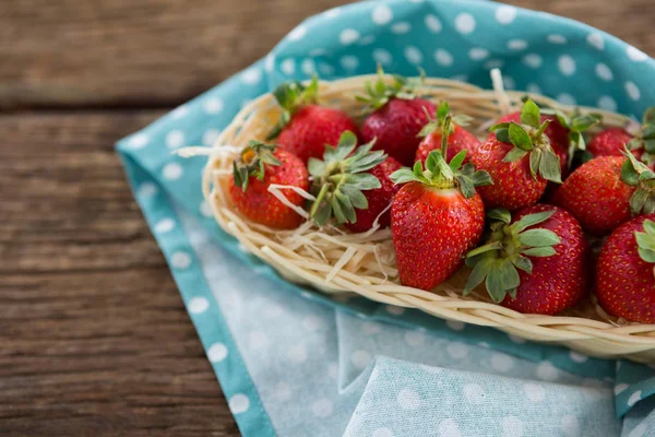 Fresh strawberries in wicker tray — Stock Photo, Image