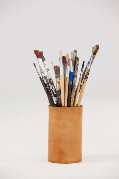 Varieties of paint brushes in jar — Stock Photo, Image