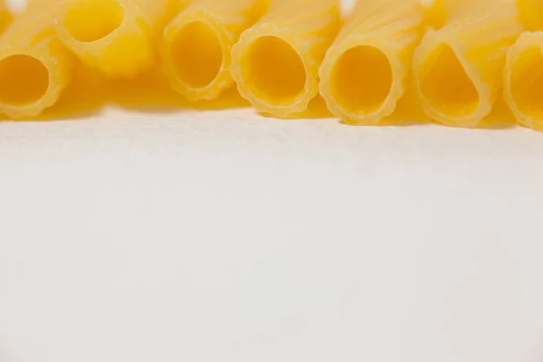 Pennette pasta on white background — Stock Photo, Image