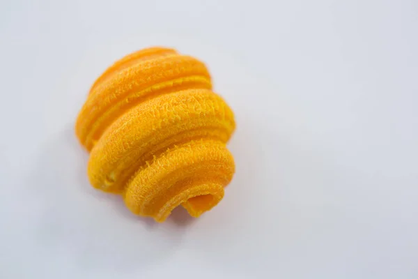 Yellow colored pasta on white background — Stock Photo, Image