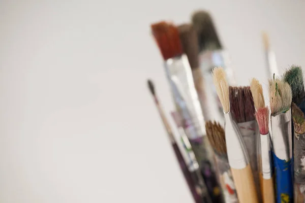Varieties of paint brushes in jar — Stock Photo, Image