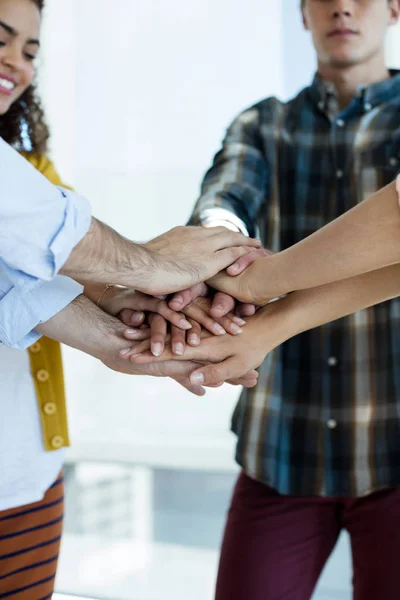 Creative business team stacking hands together — Stock Photo, Image