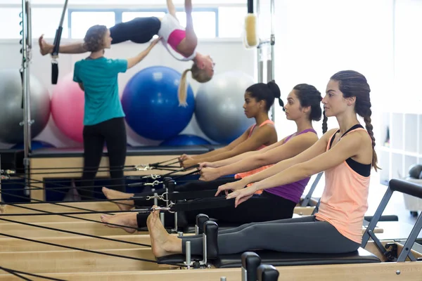 Group of women exercising on reformer — Stock Photo, Image