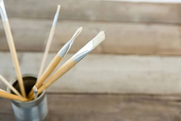 Various paintbrush in container — Stock Photo, Image