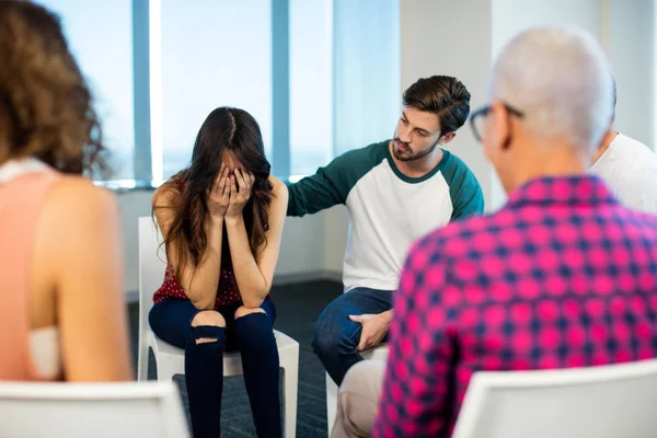 Creative business team consoling upset colleague — Stock Photo, Image