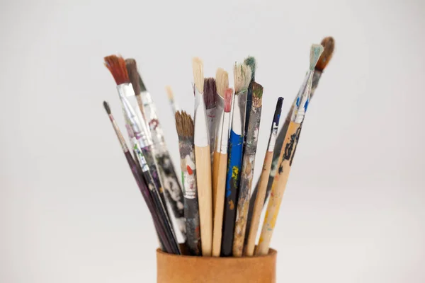 Varieties of paint brushes in jar — Stock Photo, Image