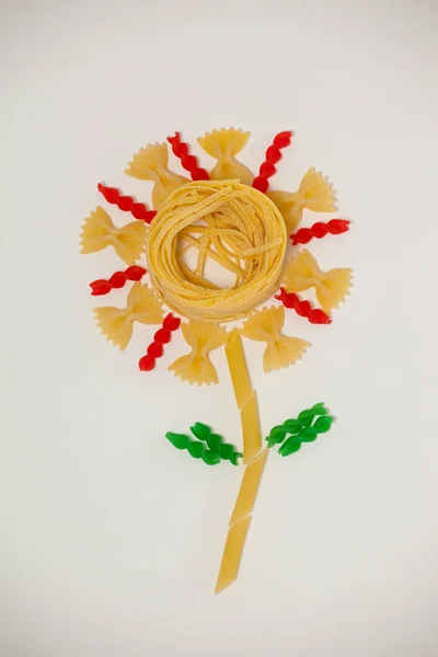 Varieties of pasta making a flower — Stock Photo, Image
