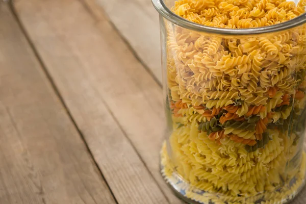 Girandole pasta in a glass container — 스톡 사진