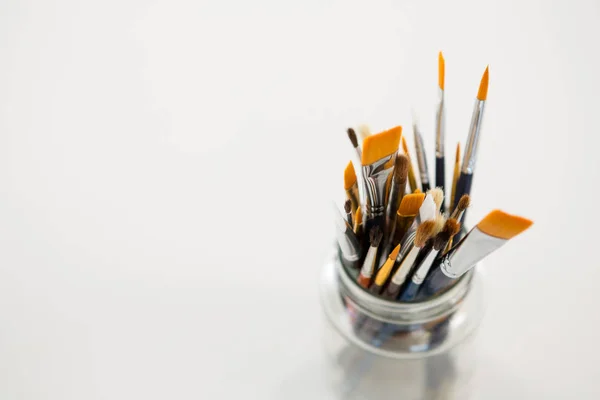 Various paintbrush in a jar — Stock Photo, Image