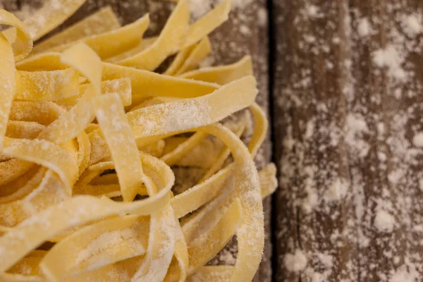 Fettuccine pasta dusted with flour — Stock Photo, Image